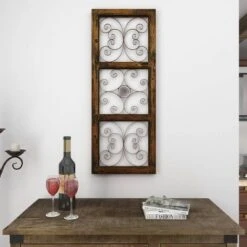 36" X 14" Wood Scroll Window Inspired Wall Decor With Metal Scrollwork Relief Brown - Olivia & May -Olivia & May GUEST b367931e 6ed0 4d1a ba17 4cf4aca6a24e