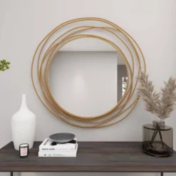 Metal Wall Mirror With Overlapping Ring Frame Gold - Olivia & May -Olivia & May GUEST e27e07da 9473 48b0 8e6a 957990d84b52
